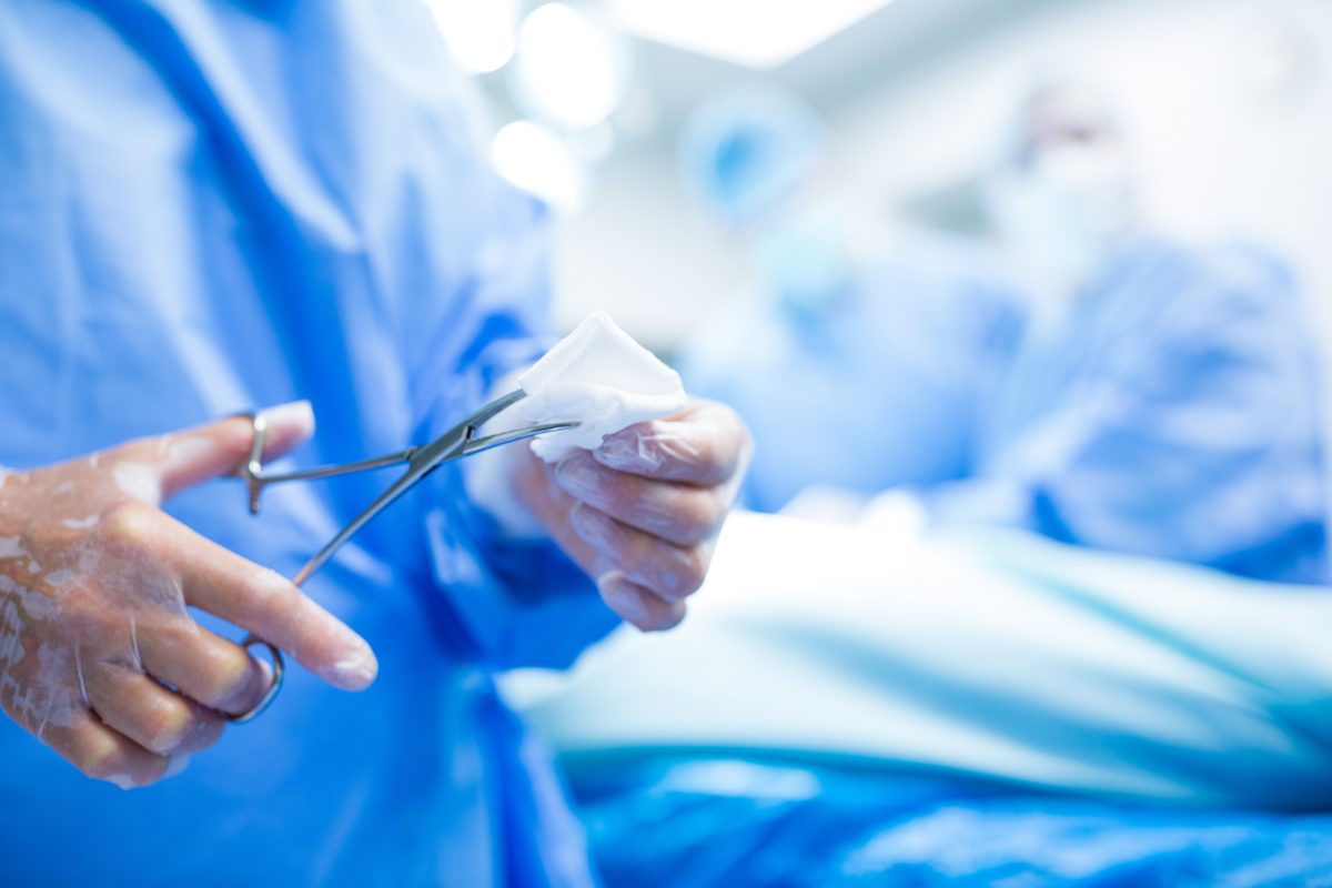 surgeon-cutting-cotton-from-scissor-operation-room-1200x800.jpg